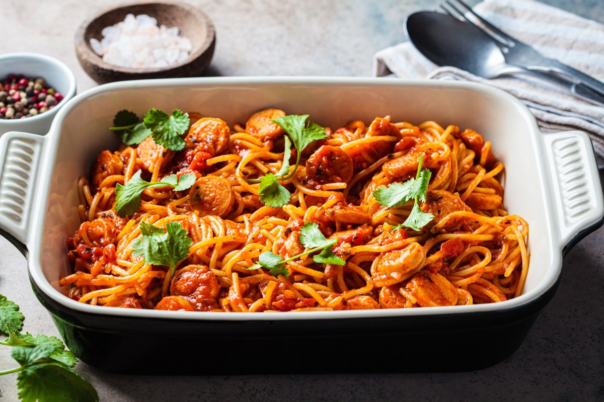 Baked spaghetti and sausage in a baking dish.