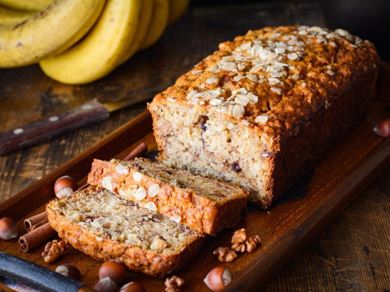 Sliced oat and banana bread on a board