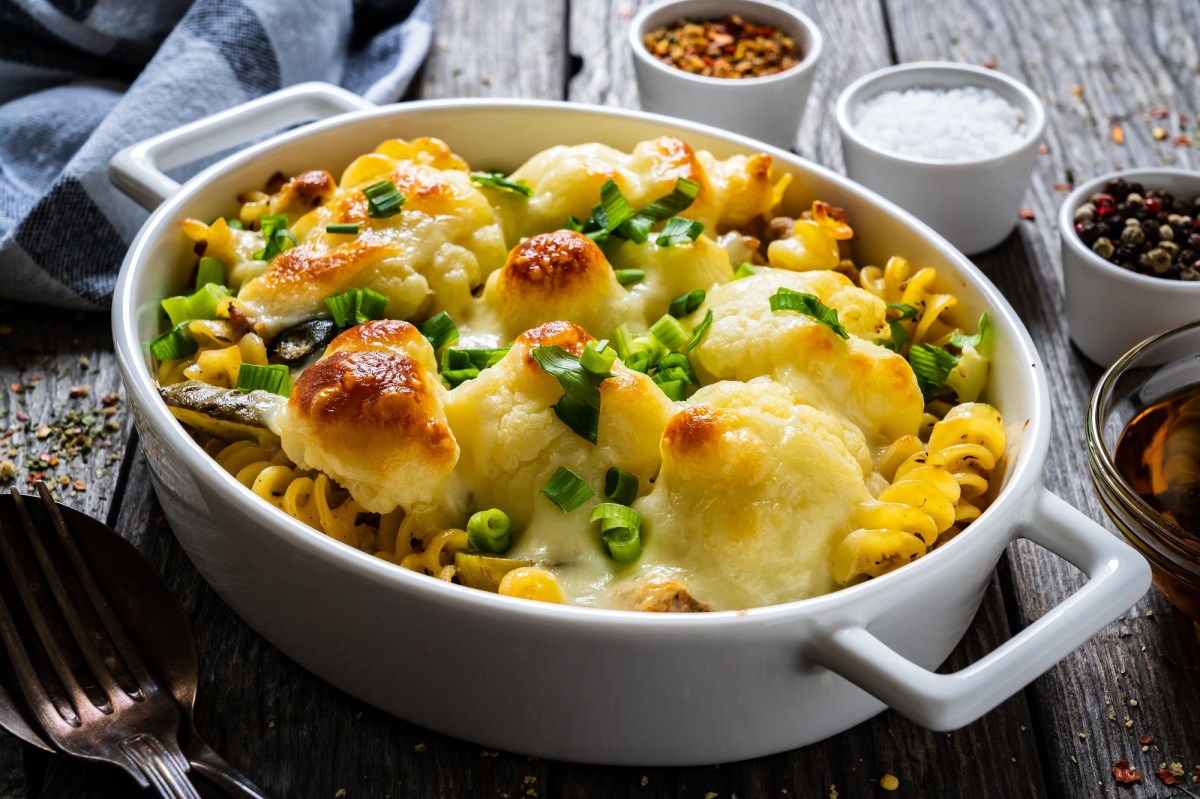 Baking dish with cauliflower pasta bake on a table