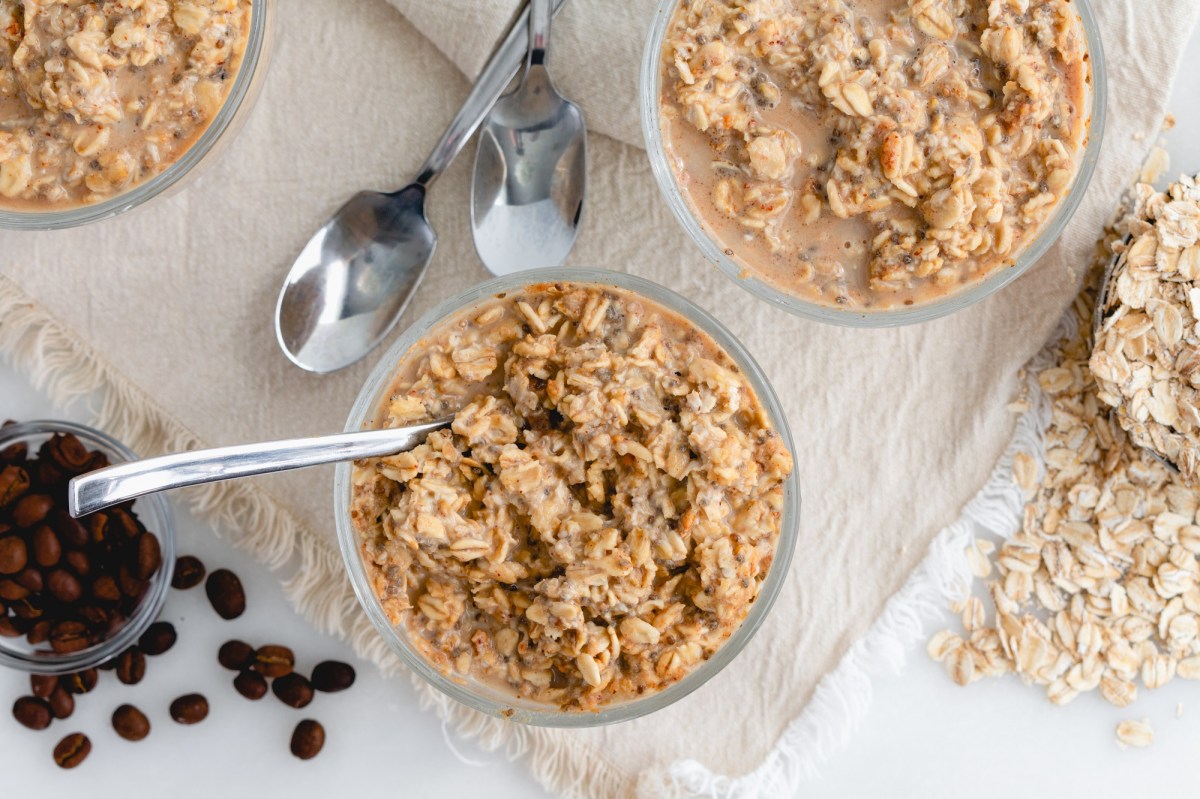 Two bowls of coffee overnight oats and coffee beans