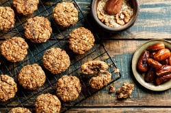 Tray with date-oatmeal cookies and dates next to it