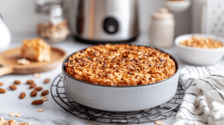 Baked oats from the air fryer in a round dish. An air fryer is visible in the background.