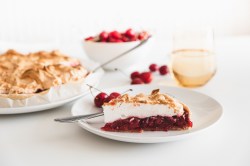 A piece of cherry cake with meringue.