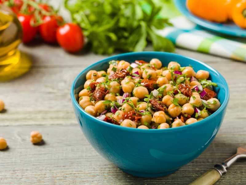 Chickpea salad with sundried tomatoes in a bowl.
