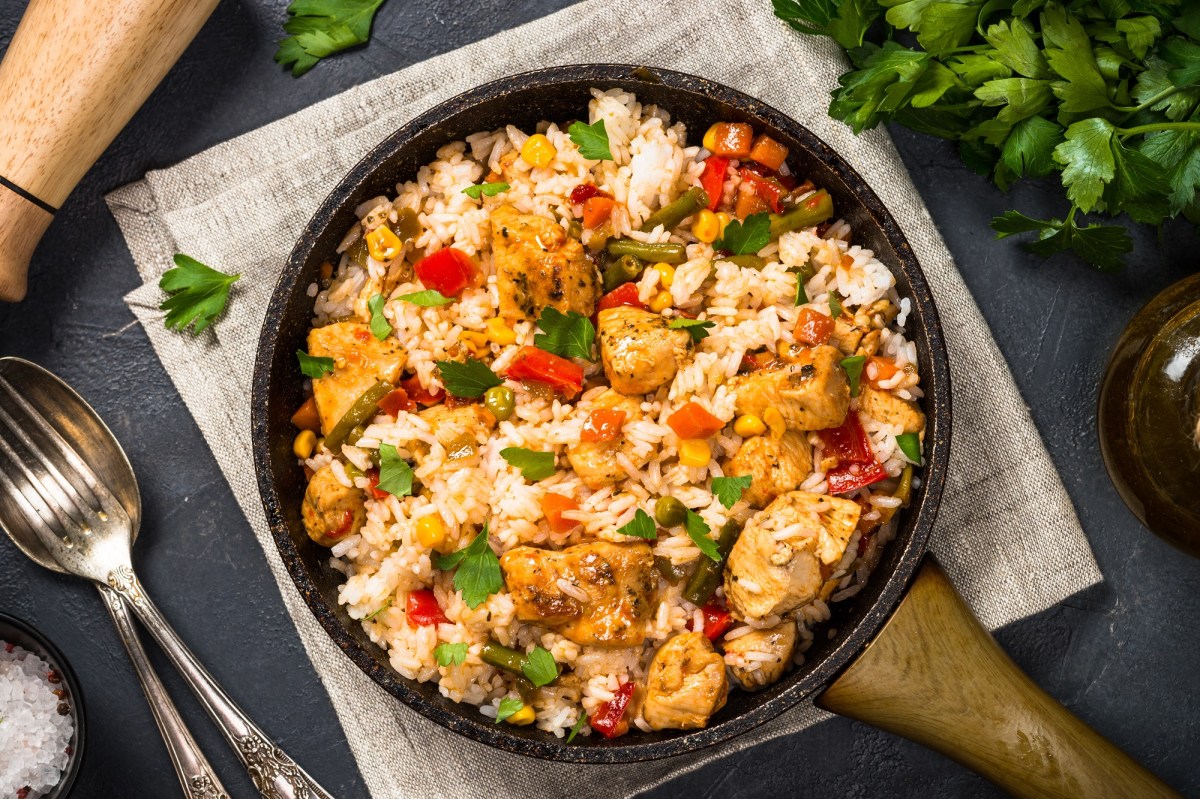 A chicken and rice skillet with vegetables.