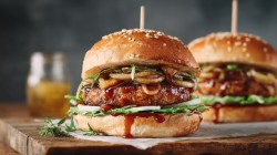 Two vegetarian oatmeal burgers with onion jam.