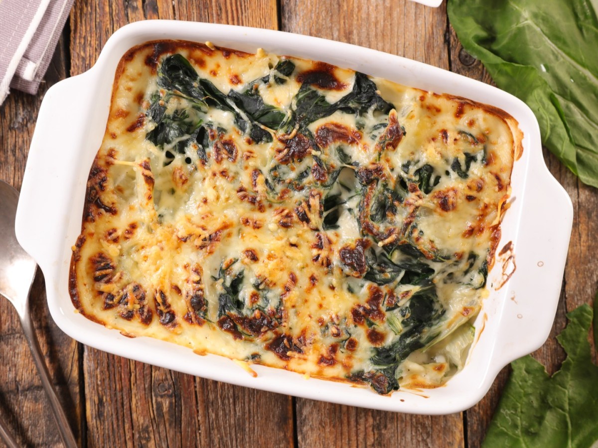 A Swiss chard casserole in a baking dish, top view.