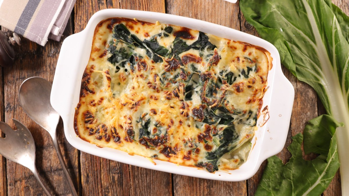 A Swiss chard casserole in a baking dish, top view.