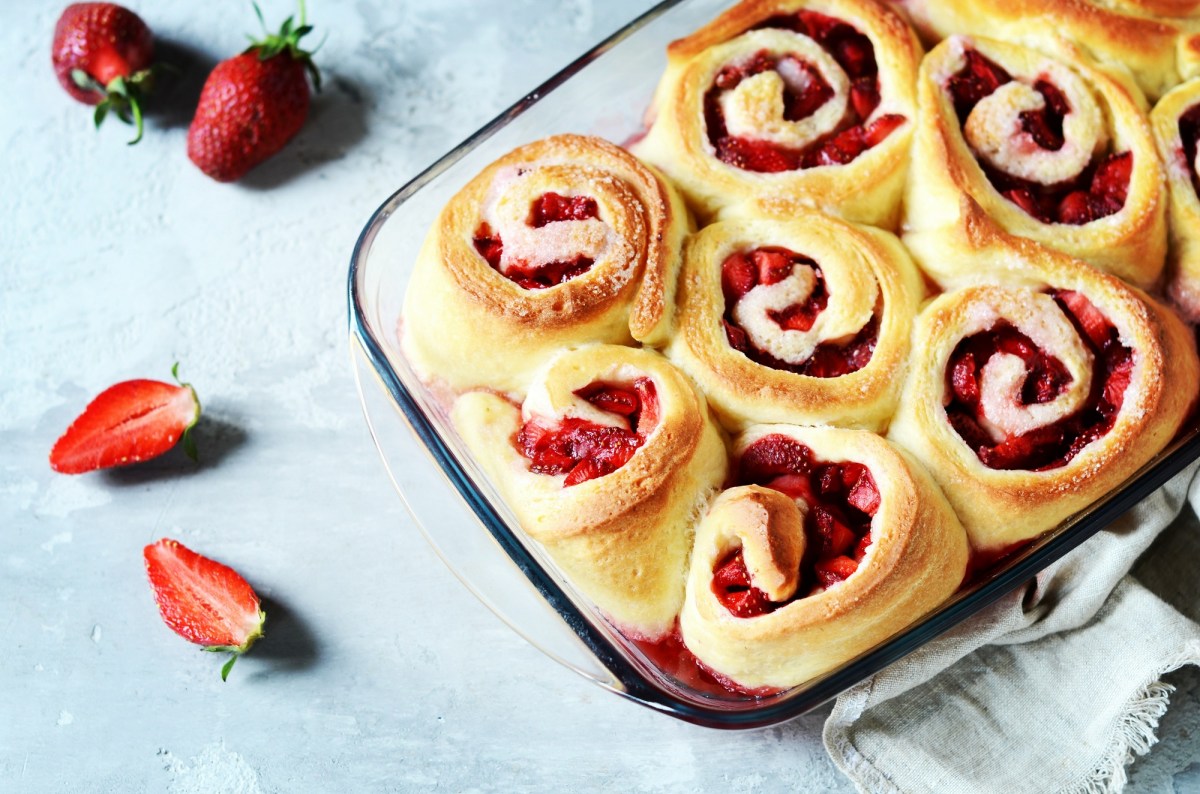 Baking dish with strawberry cinnamon rolls.