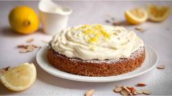 Plate with almond cake with lemon mascarpone cream