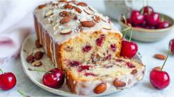 Sliced cherry-almond loaf cake on a table
