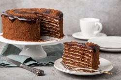 Chocolate-honey cake with a slice cut out.