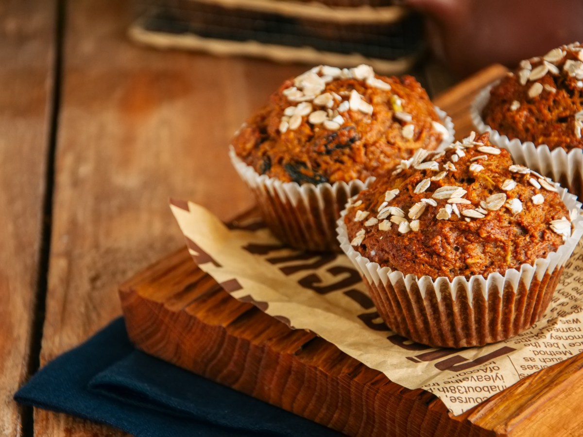 Morning Glory Muffins on a wooden board.