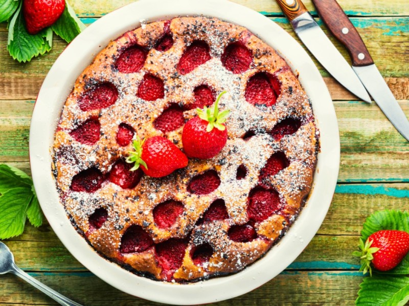 An overhead view of a sunken strawberry cake.