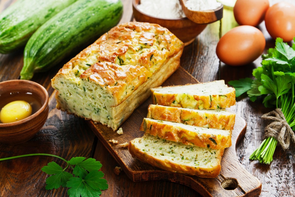 Sliced zucchini-feta bread on a board