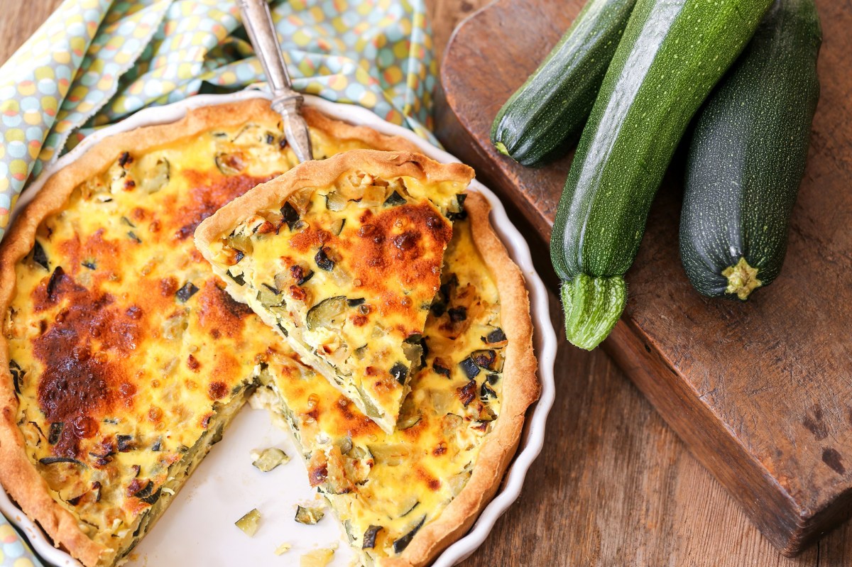 A zucchini quiche on a table.