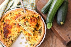 A zucchini quiche on a table.